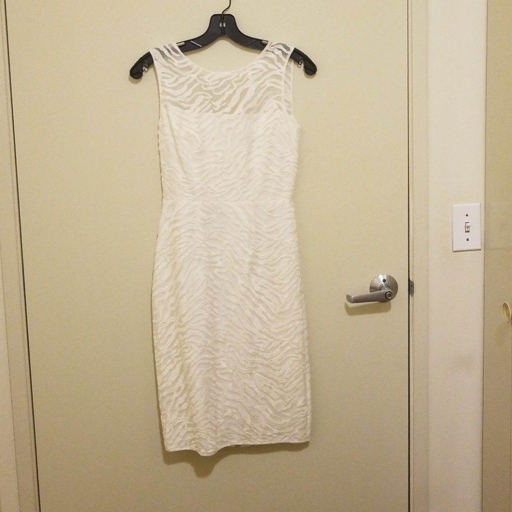 Curve-hugging white midi dress